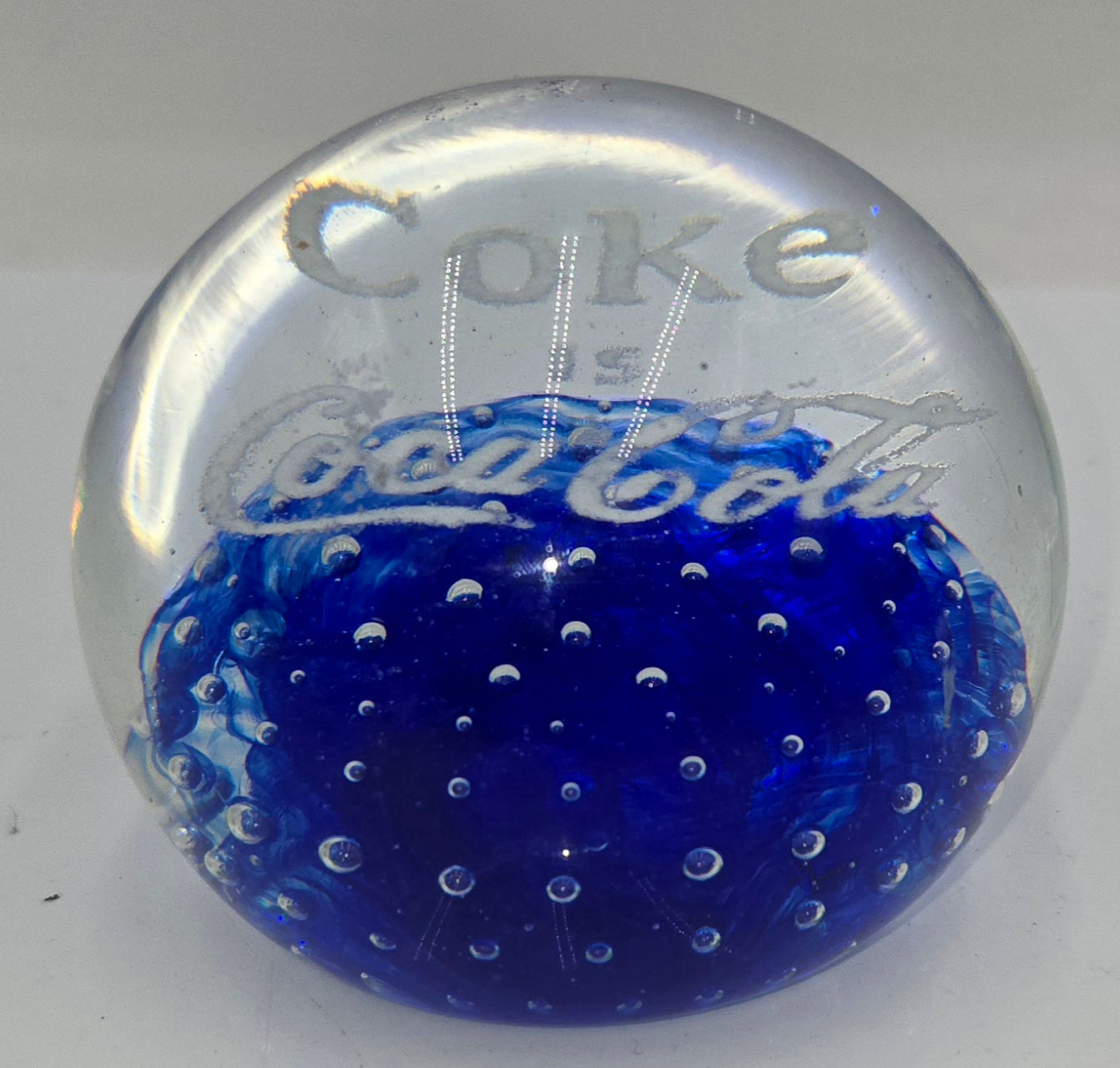 Coke is Coca-Cola glass advertising paperweight.  (100 Tickets Available)