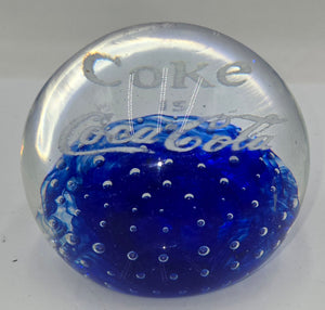 Coke is Coca-Cola glass advertising paperweight.  (100 Tickets Available)