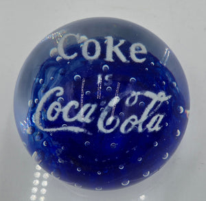 Coke is Coca-Cola glass advertising paperweight.  (100 Tickets Available)
