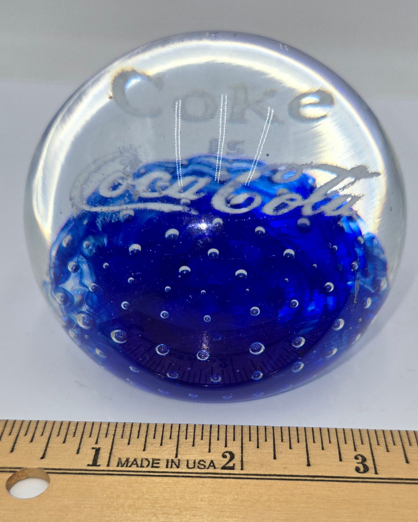 Coke is Coca-Cola glass advertising paperweight.  (100 Tickets Available)