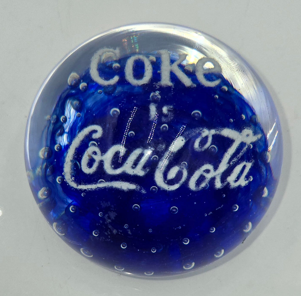 Coke is Coca-Cola glass advertising paperweight.  (100 Tickets Available)