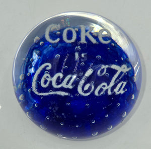 Coke is Coca-Cola glass advertising paperweight.  (100 Tickets Available)